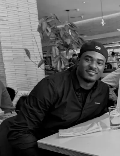 Great, seated at a table in a restaurant